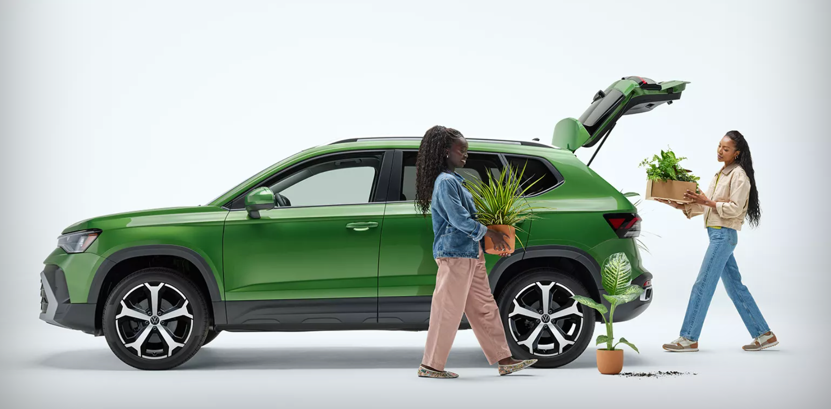 People putting plants in a 2025 Taos