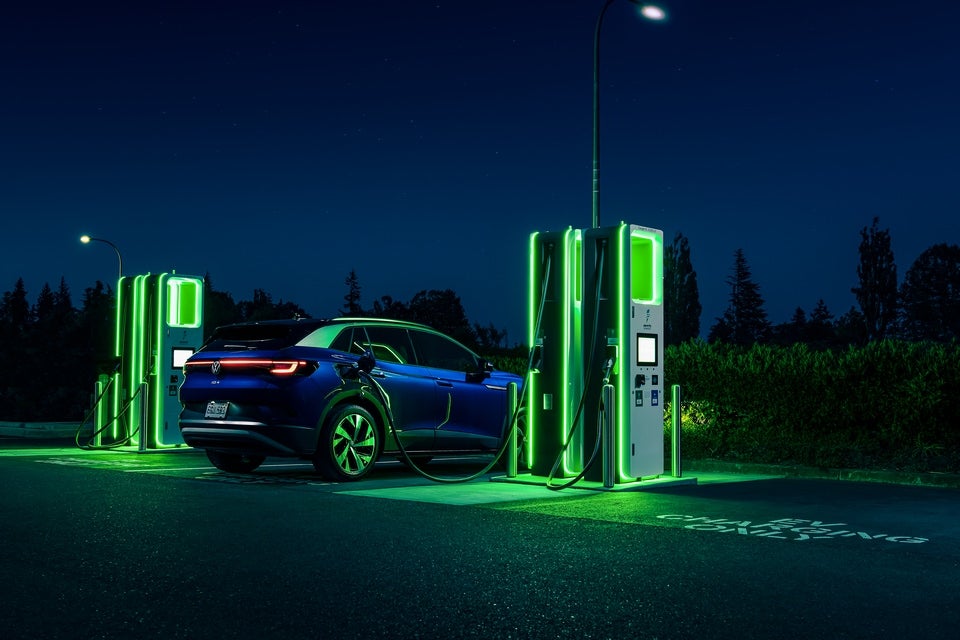 A Volkswagen ID.4 charging at night